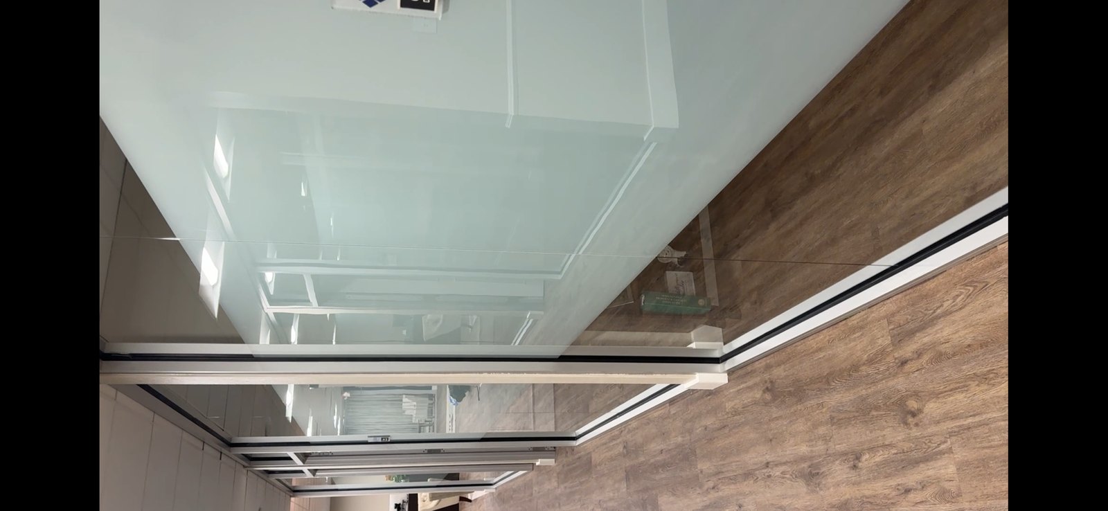 Frosted privacy film on office glass partition
