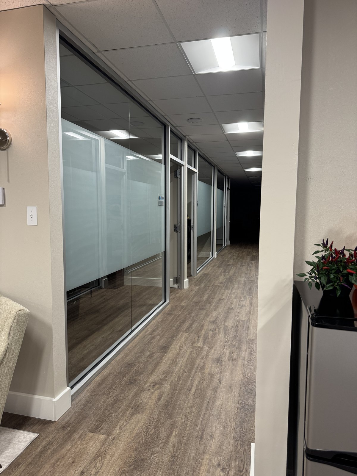 Office hallway with frosted privacy film by Threshold